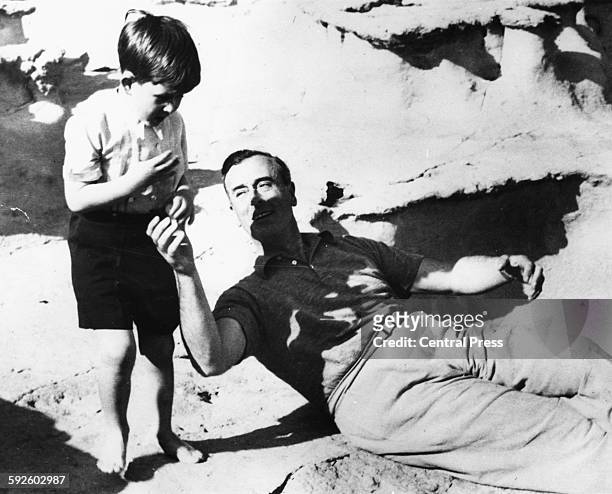 The young Prince Charles playing with his great uncle, Lord Louis Mountbatten, after landing on the coast of Malta, April 27th 1954.