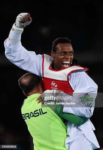 Maicon Siqueira of Brazil celebrates after defeating Mahama Cho of Great Britain during the Men's +80kg Bronze Medal contest on Day 15 of the Rio...