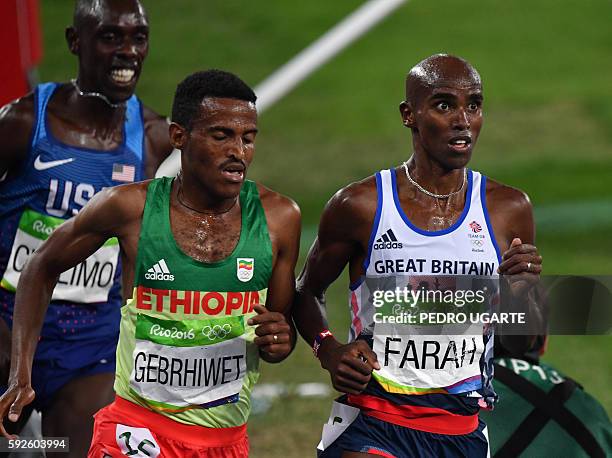 Ethiopia's Hagos Gebrhiwet and Britain's Mo Farah compete in the Men's 5000m Final during the athletics event at the Rio 2016 Olympic Games at the...