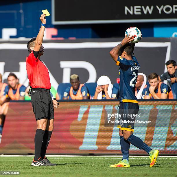 Defender A. J. DeLaGarza of Los Angeles Galaxy receives a yellow card during the match vs New York City FC at Yankee Stadium on August 20, 2016 in...