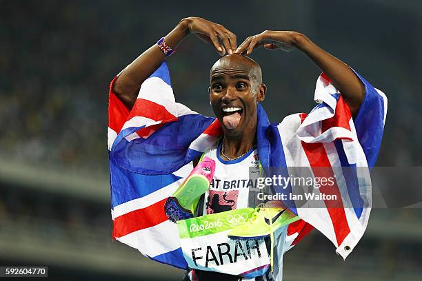 Mohamed Farah of Great Britain reacts after winning gold in the Men's 5000 meter Final on Day 15 of the Rio 2016 Olympic Games at the Olympic Stadium...