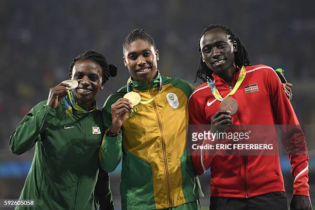 Silver medallist Burundi's Francine Niyonsaba, gold medallist South Africa's Caster Semenya, and bronze medallist Kenya's Margaret Nyairera Wambui...