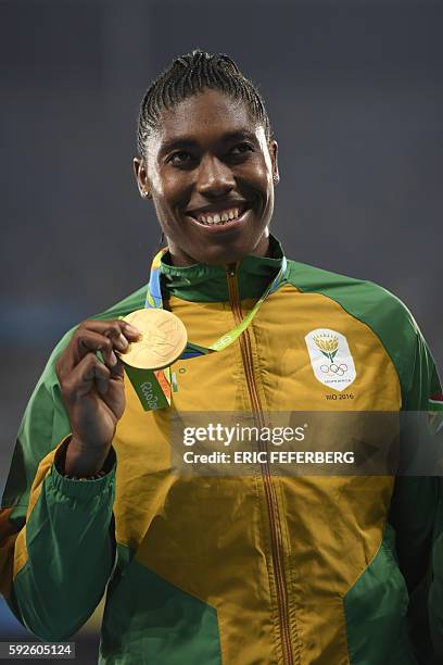 Gold medallist South Africa's Caster Semenya poses on the podium for the Women's 800m Final during the athletics event at the Rio 2016 Olympic Games...