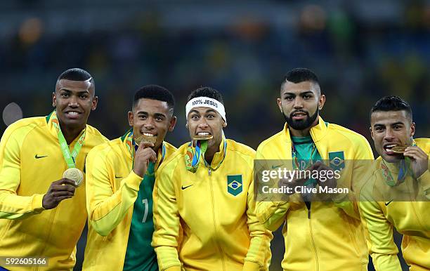 Walace of Brazil, Gabriel Jesus of Brazil, Neymar of Brazil, Gabriel Barbosa of Brazil and Rafinha of Brazil celebrate with their gold medals...