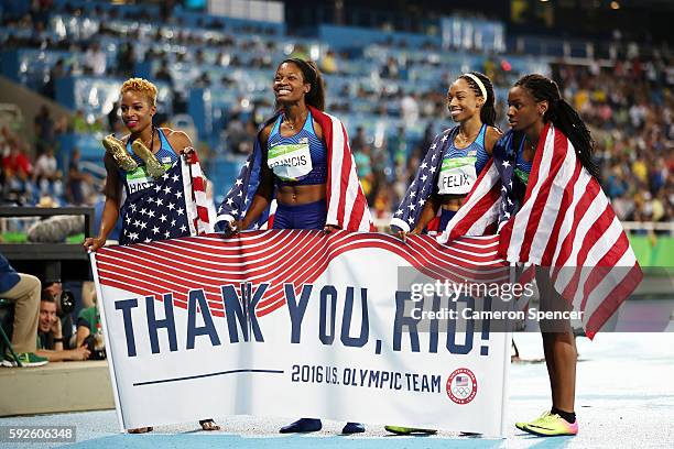 Natasha Hastings, Phyllis Francis, Allyson Felix and Courtney Okolo of the United States react after winning gold in the Women's 4 x 400 meter Relay...