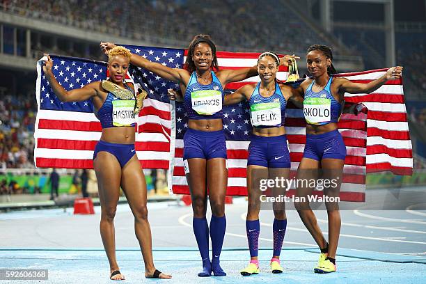 Natasha Hastings, Phyllis Francis, Allyson Felix and Courtney Okolo of the United States react after winning gold in the Women's 4 x 400 meter Relay...