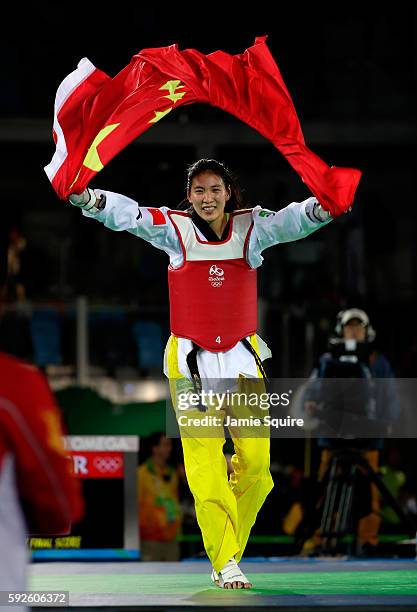 Shuyin Zheng of China celebrates beating Maria del Rosario Espinoza Espinoza of Mexico during the Taekwondo Women +67kg Gold Medal Contest on Day 15...