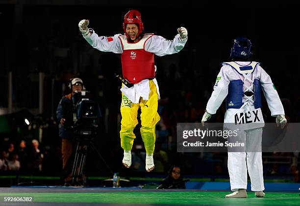 Shuyin Zheng of China celebrates beating Maria del Rosario Espinoza Espinoza of Mexico during the Taekwondo Women +67kg Gold Medal Contest on Day 15...