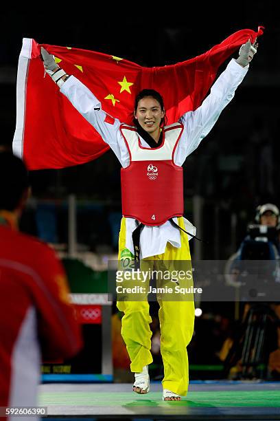 Shuyin Zheng of China celebrates beating Maria del Rosario Espinoza Espinoza of Mexico during the Taekwondo Women +67kg Gold Medal Contest on Day 15...