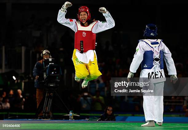 Shuyin Zheng of China celebrates beating Maria del Rosario Espinoza Espinoza of Mexico during the Taekwondo Women +67kg Gold Medal Contest on Day 15...