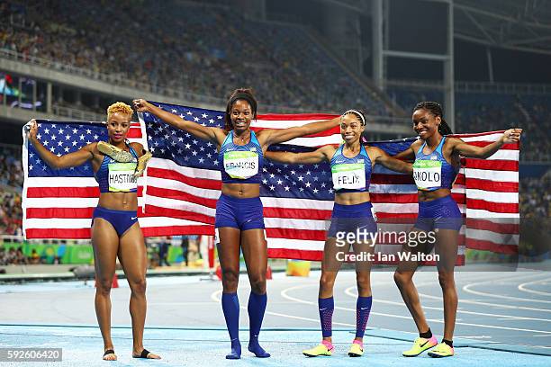 Natasha Hastings, Phyllis Francis, Allyson Felix and Courtney Okolo of the United States react after winning gold in the Women's 4 x 400 meter Relay...