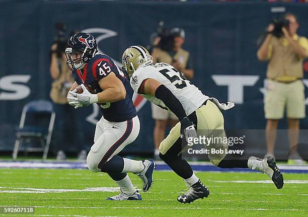 Jay Prosch of the Houston Texans is pursued by Nate Stupar of the New Orleans Saints in the second quarter during a preseaon NFL game at NRG Stadium...