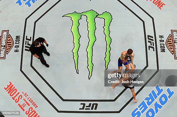 Cody Garbrandt fights Takeya Mizugaki of Japan in their bantamweight bout during the UFC 202 event at T-Mobile Arena on August 20, 2016 in Las Vegas,...