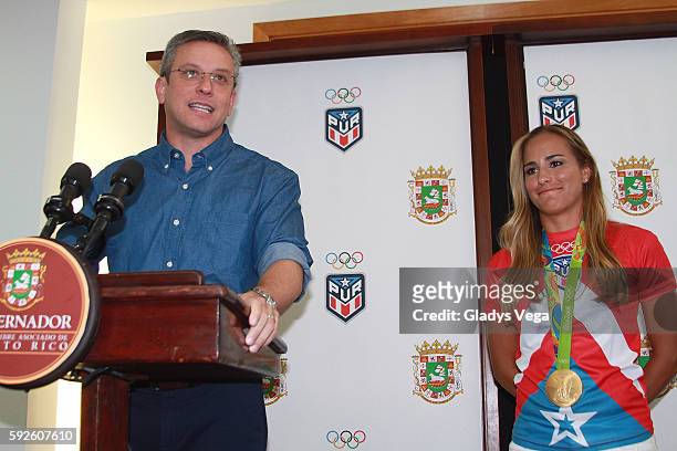 Governor of Puerto Rico Alejandro Garcia Padilla and Gold Medalist Monica Puig in a Press Conference as part of her arrival at Luis Munoz Marin...