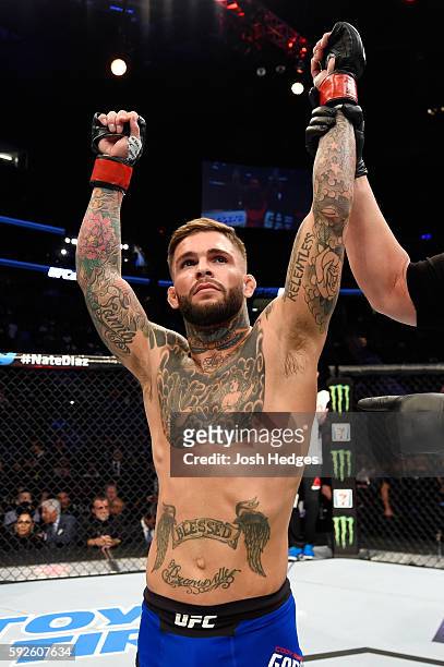 Cody Garbrandt celebrates after defeating Takeya Mizugaki of Japan in their bantamweight bout during the UFC 202 event at T-Mobile Arena on August...
