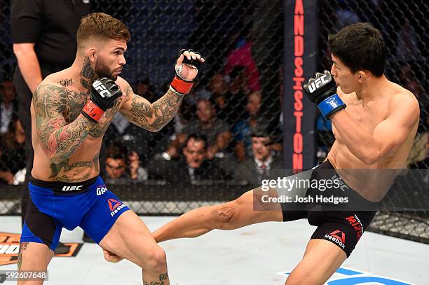 Cody Garbrandt fights Takeya Mizugaki of Japan in their bantamweight bout during the UFC 202 event at T-Mobile Arena on August 20, 2016 in Las Vegas,...