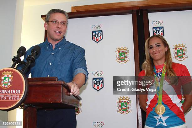 Governor of Puerto Rico Alejandro Garcia Padilla and Gold Medalist Monica Puig in a Press Conference as part of her arrival at Luis Munoz Marin...