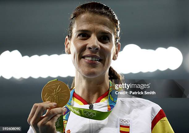 Ruth Beitia of Spain stands on the podium during the medal ceremony for the Women's High Jump on Day 15 of the Rio 2016 Olympic Games at the Olympic...