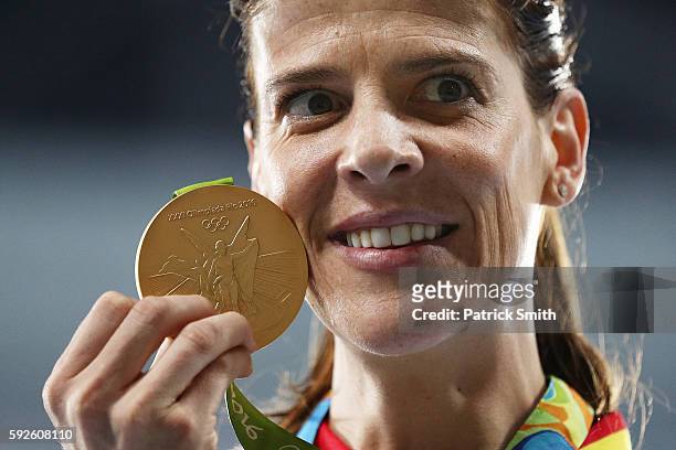Ruth Beitia of Spain stands on the podium during the medal ceremony for the Women's High Jump on Day 15 of the Rio 2016 Olympic Games at the Olympic...