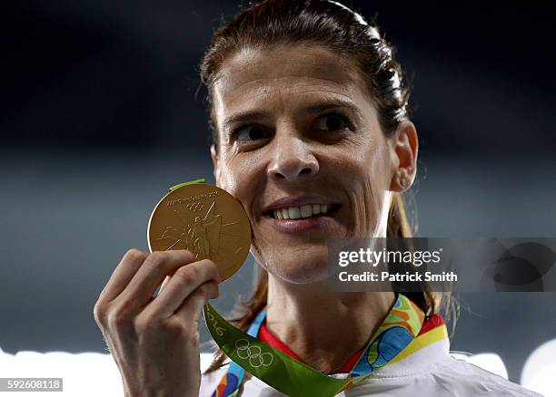 Ruth Beitia of Spain stands on the podium during the medal ceremony for the Women's High Jump on Day 15 of the Rio 2016 Olympic Games at the Olympic...