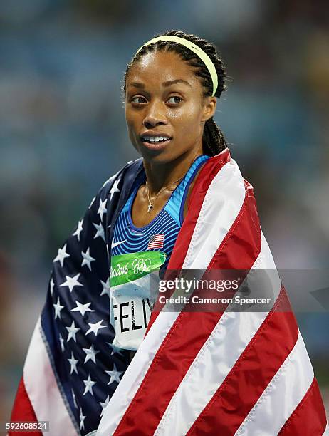 Allyson Felix of the United States reacts after winning gold during the Women's 4 x 400 meter Relay on Day 15 of the Rio 2016 Olympic Games at the...