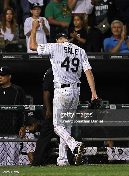 Starting pitcher Chris Sale of the Chicago White Sox waves to the crowd after the 8th inning on his way to his 15th win of the season against the...