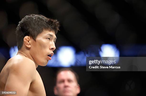 Takeya Mizugaki waits for the start of his bantamweight bout against Cody Garbrandt at the UFC 202 event at T-Mobile Arena on August 20, 2016 in Las...