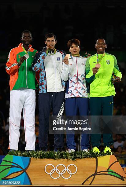 Silver medalist Abdoulrazak Issoufou Alfaga of Niger, Gold medalist Radik Isaev of Azerbaijan and Bronze medalists Dongmin Cha of Korea and Maicon...