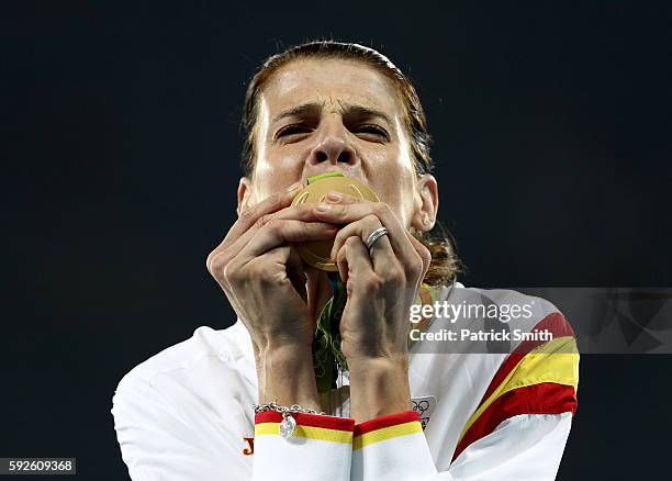 Ruth Beitia of Spain stands on the podium during the medal ceremony for the Women's High Jump on Day 15 of the Rio 2016 Olympic Games at the Olympic...