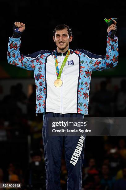 Gold medalist Radik Isaev of Azerbaijan celebrates on the podium during the medal ceremony for the Men's +80kg Gold Medal contest on Day 15 of the...