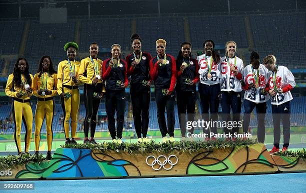 Silver Medalist Jamaica, gold medalists the United States and bronze medalists Great Britain stand on the podium during the medal ceremony for the...