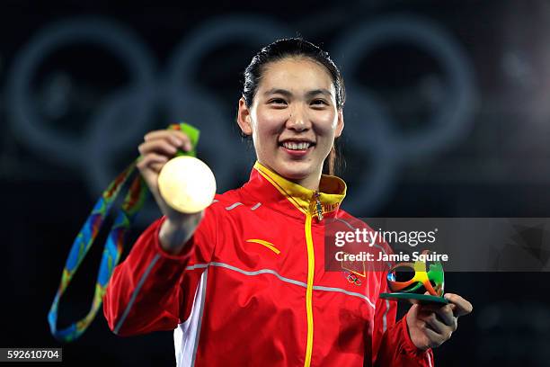 Gold medalist Shuyin Zheng of China celebrates on the podium during the medal ceremony for the Taekwondo Women +67kg Gold Medal Contest on Day 15 of...