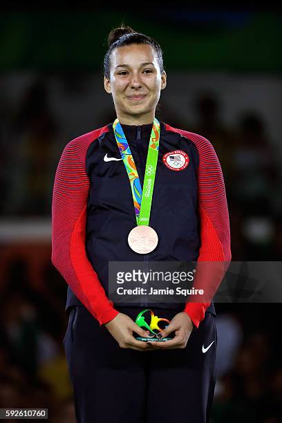 Bronze medalists Jackie Galloway of the United States celebrates on the podium during the medal ceremony for the Taekwondo Women +67kg Gold Medal...
