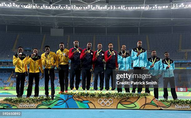 Silver medalists Jamaica, gold medalists the United States and bronze medalists Bahamas stand on the podium during the medal ceremony for the Men's 4...