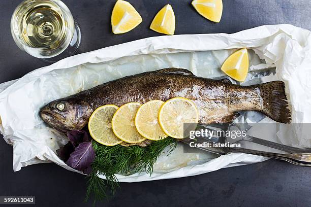 parchment baked rainbow trout, top view - rainbow trout stock pictures, royalty-free photos & images