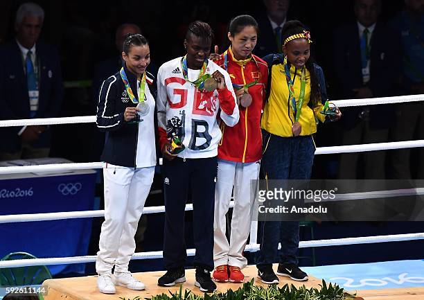 Silver medalist Sarah Ourahmoune of France, gold medalist Nicola Adams of Great Britain and bronze medalists Cancan Ren of China and Ingrit Valencia...