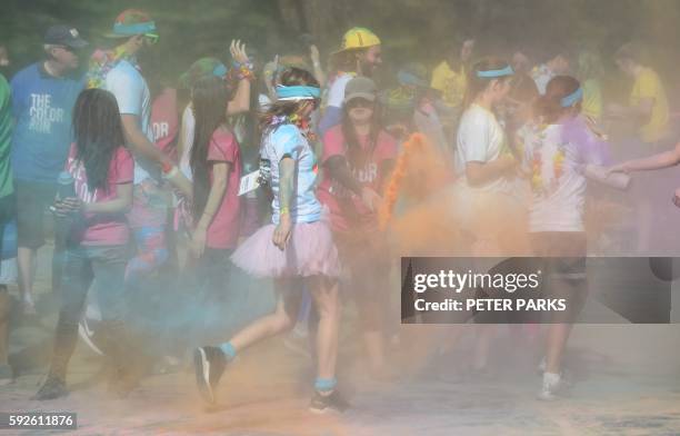 Runner participates in the annual Color Run in Centennial Park in Sydney on August 21, 2016. - The Color Run is a 5km fun run started in the US in...