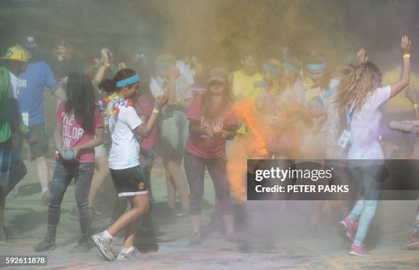 Runner participates in the annual Color Run in Centennial Park in Sydney on August 21, 2016. - The Color Run is a 5km fun run started in the US in...