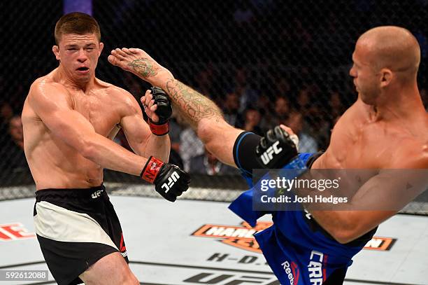 Donald Cerrone fights Rick Story in their welterweight bout during the UFC 202 event at T-Mobile Arena on August 20, 2016 in Las Vegas, Nevada.