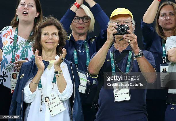 Queen Silvia of Sweden and King Carl XVI Gustaf of Sweden celebrate the silver medal of Sweden following the Women's Soccer FInal between Germany and...