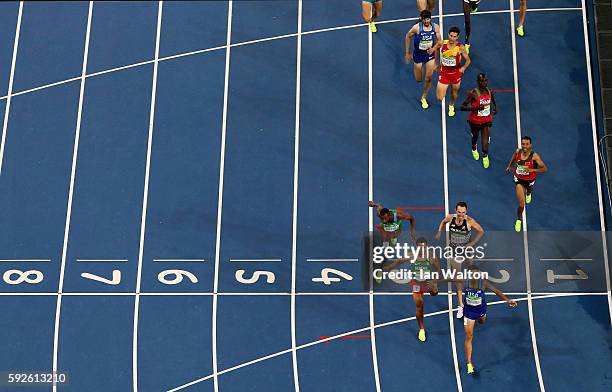 Matthew Centrowitz of the United States reacts after winning gold in front of Taoufik Makhloufi of Algeria and Nicholas Willis of New Zealand in the...