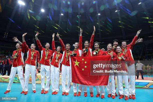 Team China celebrates after winning gold during the Women's Gold Medal Match between Serbia and China on Day 15 of the Rio 2016 Olympic Games at the...