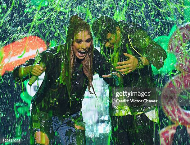 Sebastian Villalobos and Galilea Montijo get slimed on stage during the Nickelodeon Kids' Choice Awards Mexico 2016 at Auditorio Nacional on August...