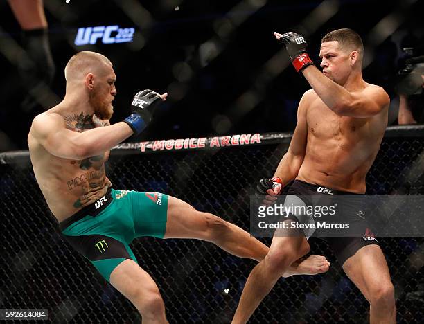 Conor McGregor kicks Nate Diaz during their welterweight rematch at the UFC 202 event at T-Mobile Arena on August 20, 2016 in Las Vegas, Nevada.