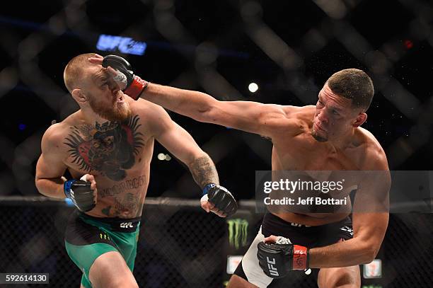 Nate Diaz fights Conor McGregor of Ireland in their welterweight bout during the UFC 202 event at T-Mobile Arena on August 20, 2016 in Las Vegas,...