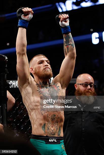 Conor McGregor gestures as he arrives for his welterweight rematch against Nate Diaz at the UFC 202 event at T-Mobile Arena on August 20, 2016 in Las...