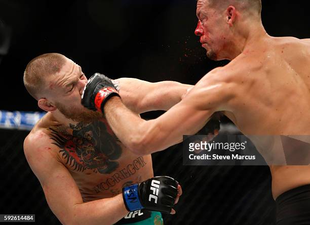 Conor McGregor and Nate Diaz trade blows during their welterweight rematch at the UFC 202 event at T-Mobile Arena on August 20, 2016 in Las Vegas,...