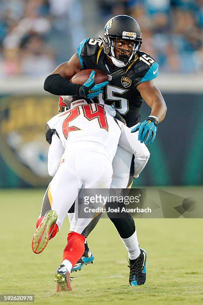 Allen Robinson of the Jacksonville Jaguars is tackled by Brent Grimes of the Tampa Bay Buccaneers as he runs with the ball during a preseason game on...