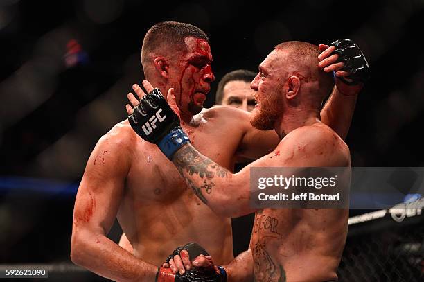 Nate Diaz shakes hands wih Conor McGregor of Ireland at the completion of their welterweight bout during the UFC 202 event at T-Mobile Arena on...