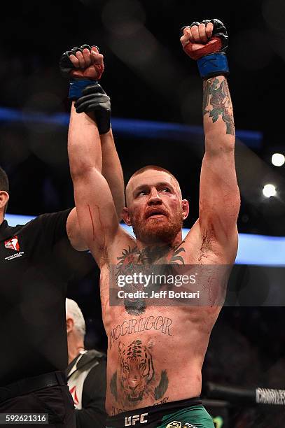 Conor McGregor of Ireland celebrates after defeating Nate Diaz in their welterweight bout during the UFC 202 event at T-Mobile Arena on August 20,...